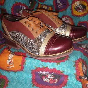 STUNNING AND PHENOMENAL PAIR OF "KAHLO SHOES". BURGUNDY LEATHER. RARE FIND.